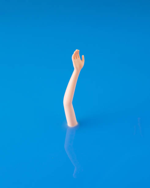 istock Creative summer arrangement made by hand and water. Minimal drowning concept. Swimming and diving inspiration. 1403321190