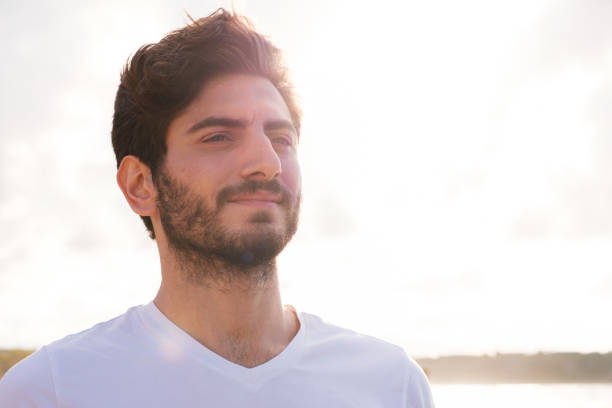 istock Man looking away portrait at sunset 1403321451