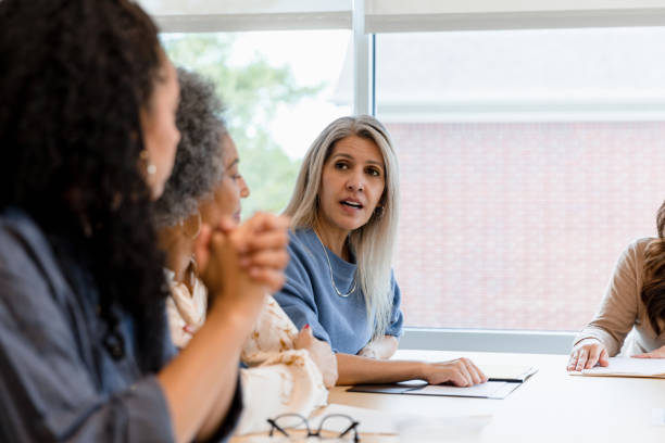 istock Team leader draws her attention to a peer 1403322591