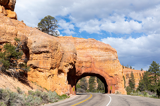 red rock tunnel and arch on the way to the Bryce canyon, USA