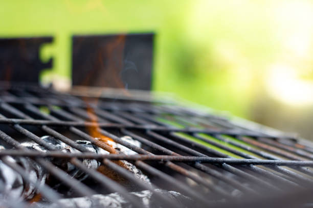 istock Close up of Barbecue Grill with Fire on Open Air. Fire flame 1403335828