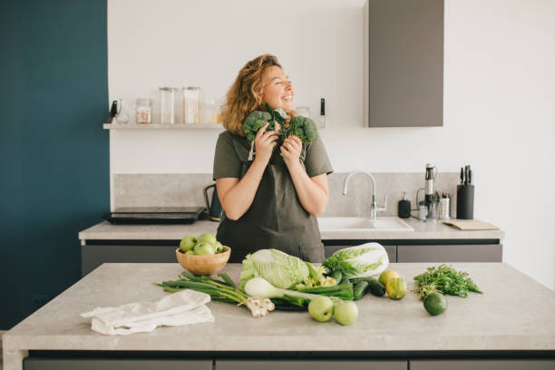 istock Still life with green fruit and vegetables on grey table in the kitchen interior. 1403337302
