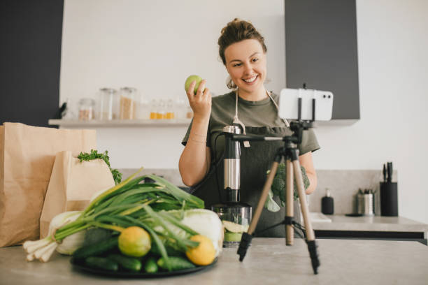 istock Still life with green fruit and vegetables on grey table in the kitchen interior. 1403337309