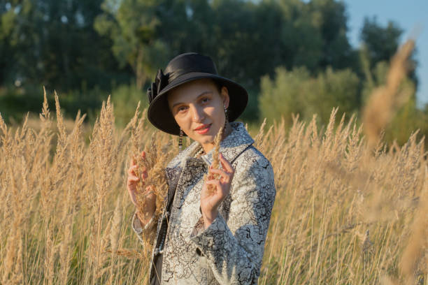 istock woman in dry grass 1403338414