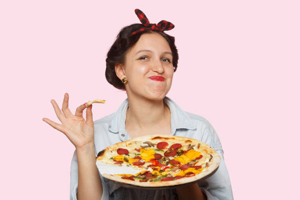 istock woman with pizza 1403339172