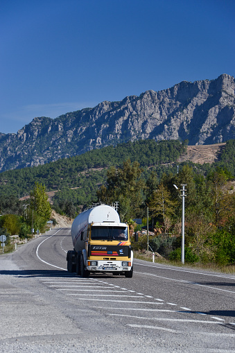 Antalya, Turkey - 14th November, 2012: Old truck BMC Fatih with driving on a road in mountain scenery. The BMC vehicles are the one of the most popular trucks in Turkey.