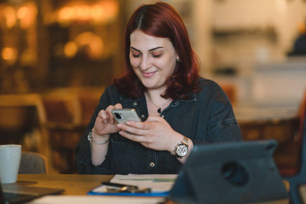 istock Corporate Businesswoman using mobile phone 1403343196