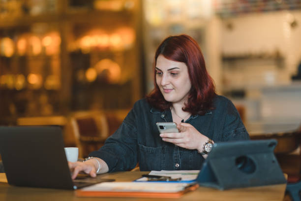 istock Corporate Businesswoman using mobile phone 1403343202
