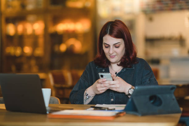 istock Corporate Businesswoman using mobile phone 1403343215