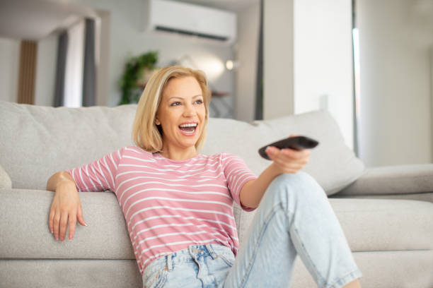 istock Woman watching TV in the room 1403345722