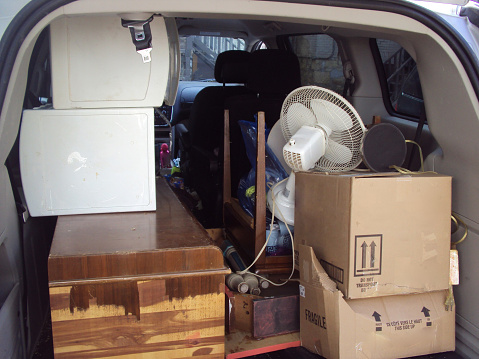 A mini van is loaded with household goods on moving day.