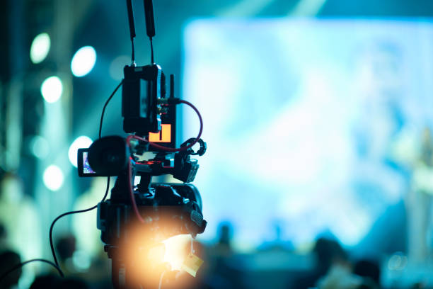 istock video camera, videographer close up, cameraman, movie 1403349448