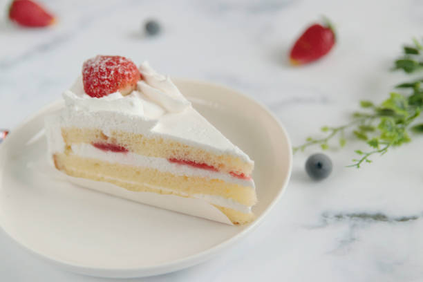istock Christmas and birthday shortcakes on the table 1403350528
