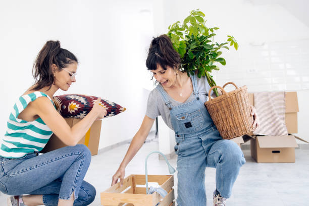 istock Twins unpacking in their new rented apartment 1403351340