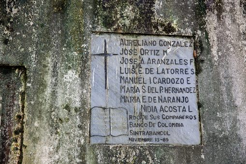 Armero, Colombia - May, 2022: Commemorative plaque with the names of the Bancolombia employees who died during the avalanche that destroyed the city of Armero caused by the Nevado del Ruiz in 1985