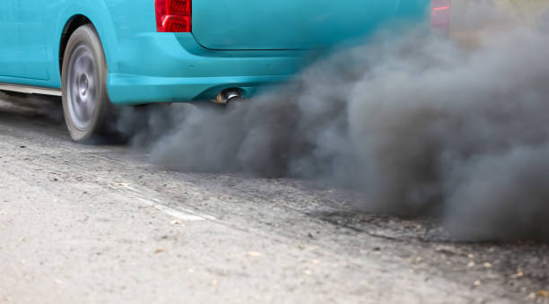 istock Air pollution from vehicle exhaust pipe on road 1403361093