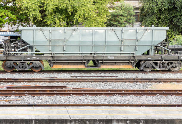 The bogie hopper wagon is parked in the station to wait for carrying stones. The bogie hopper wagon is parked in the station to wait for carrying stones to be used in railway maintenance, front view with the copy space. humphrey bogart stock pictures, royalty-free photos & images