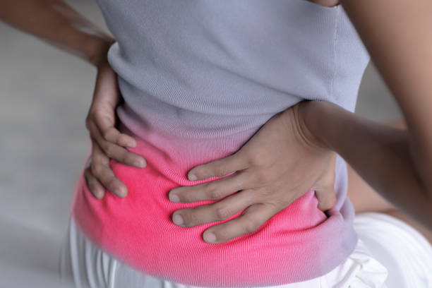 istock Woman suffering from chronic back pain. 1403374598