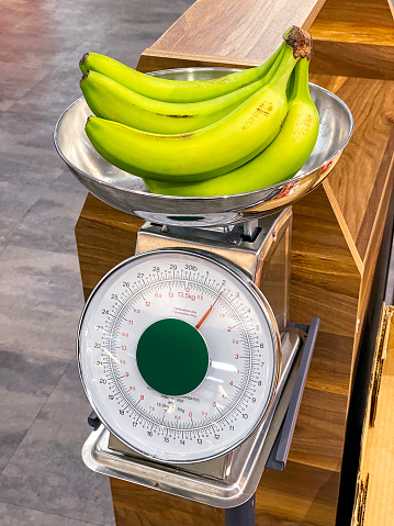 Weight scale and bananas in supermarket