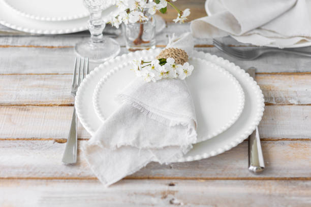 istock Rustic zero waste wedding decor with natural elements. Wooden table, candles, linen napkins, branches with green leaves. Eco-friendly decoration for the special dinner. Romantic and cozy place 1403383731