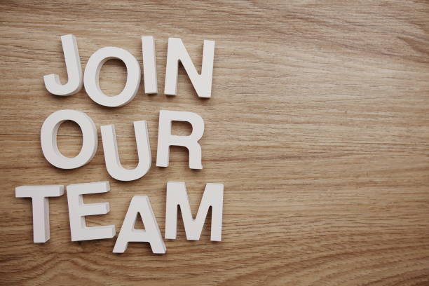 Join Our Team alphabet letters on wooden background