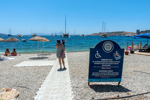 Bodrum-Mugla, Turkey; May 30, 2022: Accessible beach in Bodrum Kumbahce beach and people.