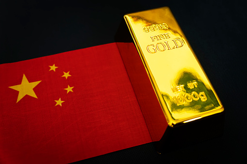 The gold bar is on the national flag of China. chinese Gold Reserve concept