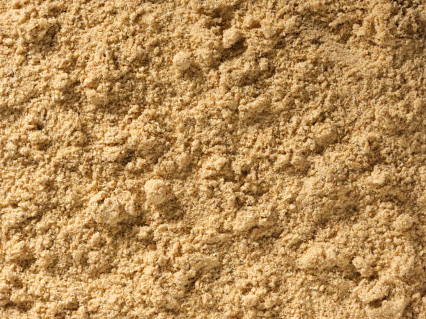 istock Ginger root powder condiment background, used as a spice in cooking. 1403396717