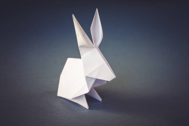 istock White paper rabbit origami isolated on a grey background 1403396823