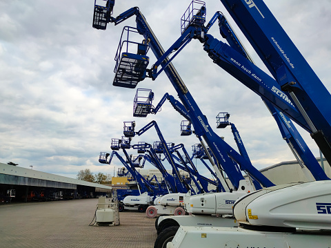 Neu-Isenburg, Germany - April 21, 2022: Bucket truck lift cranes
