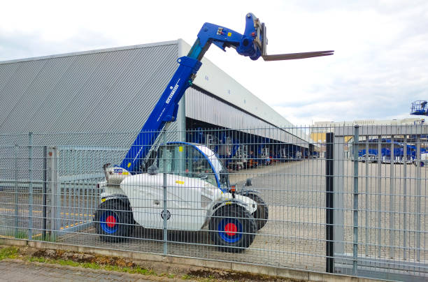 Schmidt telescopic handler equipped with fork. Neu-Isenburg, Germany - April 21, 2022: Schmidt telescopic handler equipped with fork. shipping heavy agricultural machinery stock pictures, royalty-free photos & images