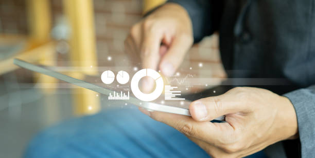 istock close up on businessman point at virtual dashboard statistic chart on digital tablet screen in office room to planning or analyzing the company's profit or business strategy for future technology concept 1403397649
