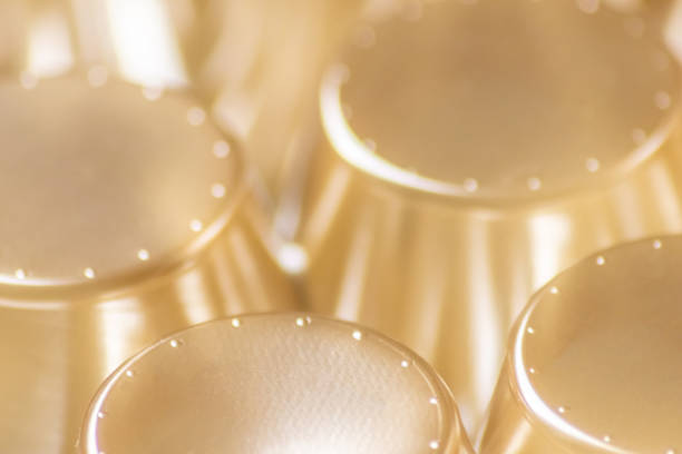 istock Abstract golden background pattern macro close-up of silver and golden metal surface with shiny reflections and harmonic shapes with circles and cones elegant futuristic design graphics metallic waves 1403399257