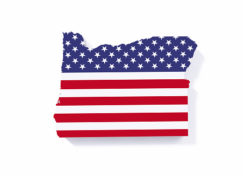 Extruded physical map of Oregon State textured with American flag on white background. Horizontal composition with copy space. Clipping path is included.