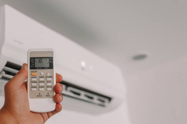 istock Hand is holding a remote control of air conditioner 1403400715