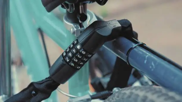 Photo of Bike Secured to Outdoor Stand with Combination Lock