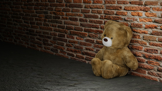 Teddy Bear sitting near old textured brick wall background. 3d rendering