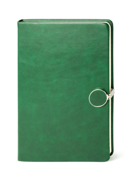Green notebook with a magnetic lock Green notebook with a magnetic lock, Isolated on white background. diary lock book cover book stock pictures, royalty-free photos & images