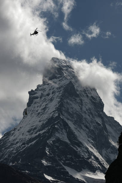 istock Matterhorn and Helicopter Passing by 1403408511