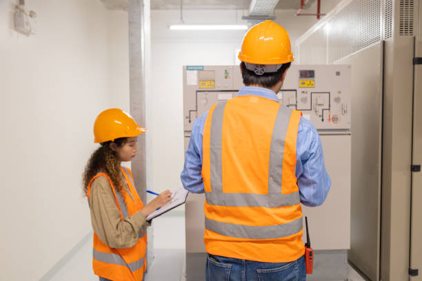 istock Engineer under checking the industry chilled water fan coil unit air conditioner is water cooling tower air chiller HVAC system of large industrial building to control air system 1403412367