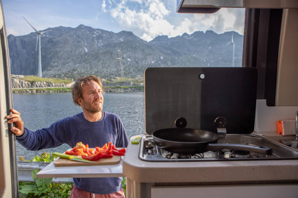 istock Preparing food in a camper van 1403412806