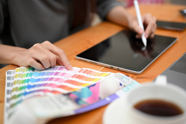 istock Female graphic designer using digital graphic tablet with stylus pen, sketching her design. 1403413081