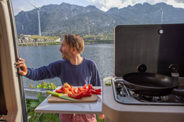 istock Preparing food in a camper van 1403413296