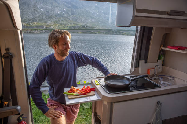 istock Preparing food in a camper van 1403413568