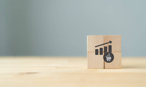 Growth of sales, average order value (AOV) concept. Strategy to get more money per oder. Increase sales in online store, e-commerce. The wooden cubes with sales growth on grey background, copy space crecimiento de las ventas, concepto de valor medio de pedido (aov). estrategia para conseguir más dinero por oder. aumentar las ventas en tienda online, e-commerce. los cubos de madera con crecimiento de ventas sobre fondo gris, espacio de copia