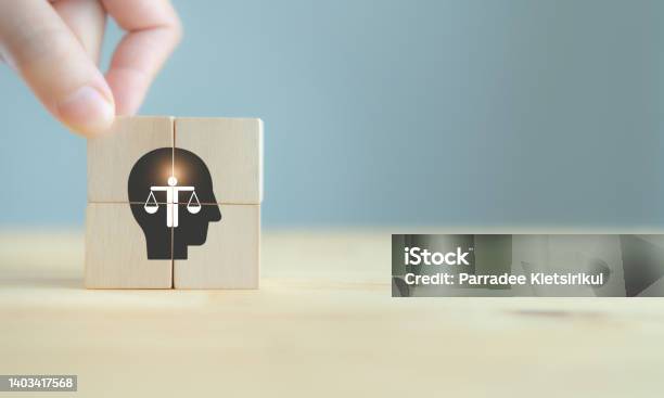 Business Ethics Concept Ethics Inside Human Mind Business Integrity And Moral The Wooden Cubes With Ethics Inside A Head Symbols On Grey Background And Copy Space Company Ethics Culture Esg Stock Photo - Download Image Now