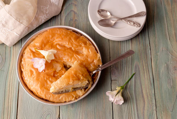 istock Milk pie with sauce on a wooden table 1403419694