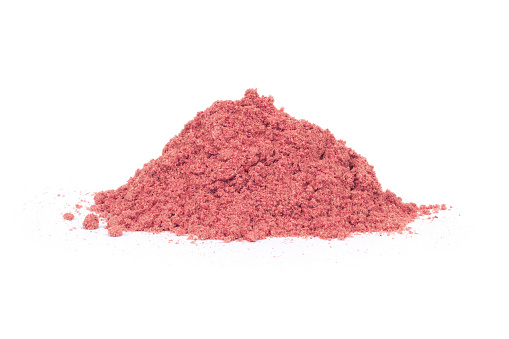 Pile of bio fruit protein powder isolated on white background.