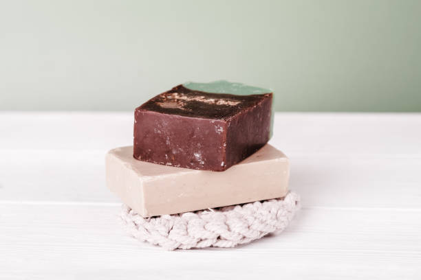 istock organic solid soap bars with coffee and oats bran. natural skin peeling routine. reusable cotton washcloth, eco hygiene product. 1403421121