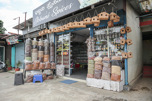 A Street view of a Spice store selling Dry fruits, indian spices and condiments in the Hill station of Madikeri town in Coorg, India.